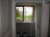 From the bottom of the stairs leading into the basement / bedroom door