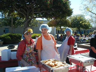 Jacquie serving food at Chesterton Elementary School