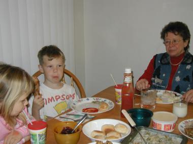 Sianna, Nathan & Grandma - Nathan with big turkey leg  Christmas 2002